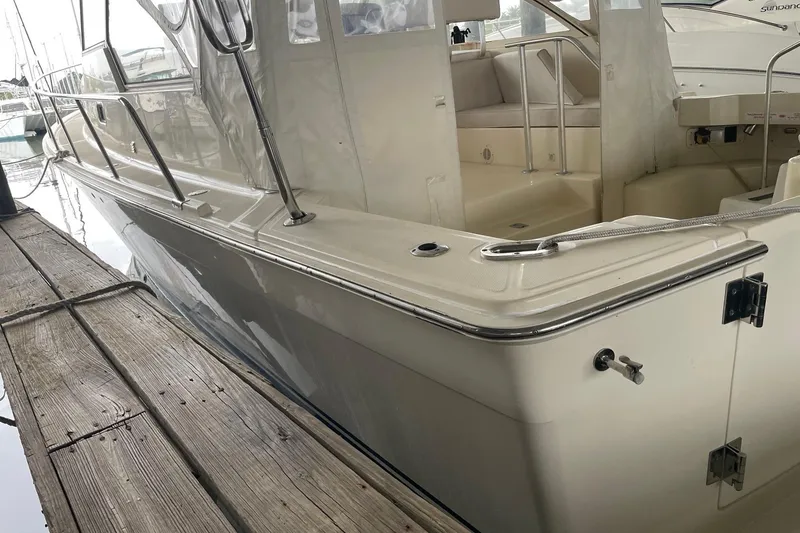 Slide: The Image of 2006 Mainship Pilot 34 docked, showcasing sleek design and spacious interior. - 33