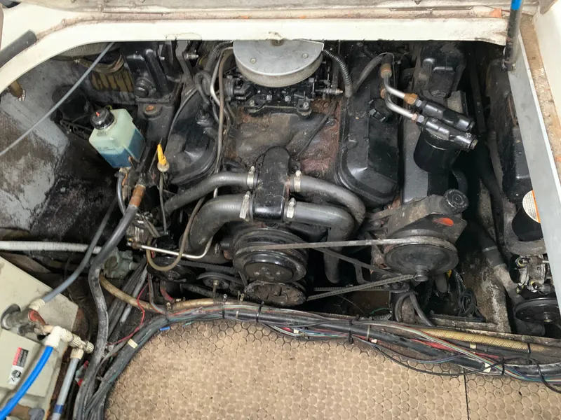 Slide: The Image of 1995 Silverton 310 Express engine compartment with visible wiring and components. - 13