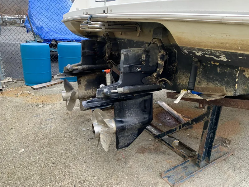 Slide: The Image of 1995 Silverton 310 Express boat with dual propellers on dry dock. - 14