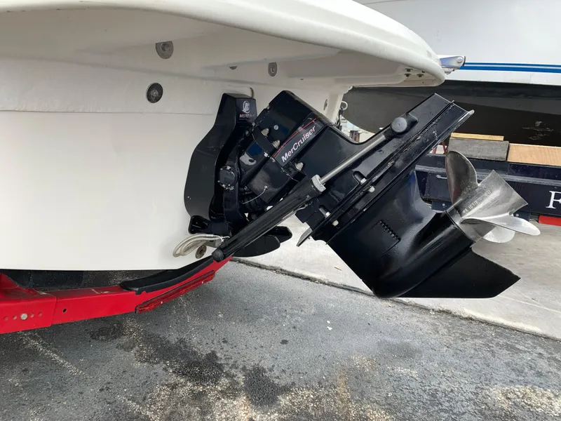 Slide: The Image of 2013 Sea Ray 190 Sport boat with MerCruiser outdrive, shown on a red trailer. - 8