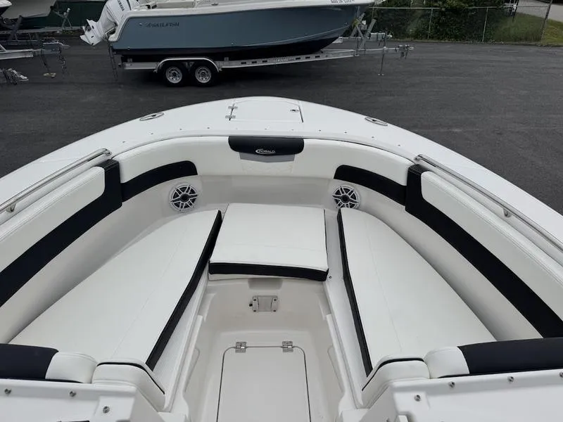 Slide: The Image of 2025 Robalo R 257 boat interior with white seating and black accents. - 4