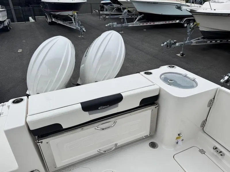 Slide: The Image of 2025 Robalo R 257 boat with dual engines and storage compartments. - 7