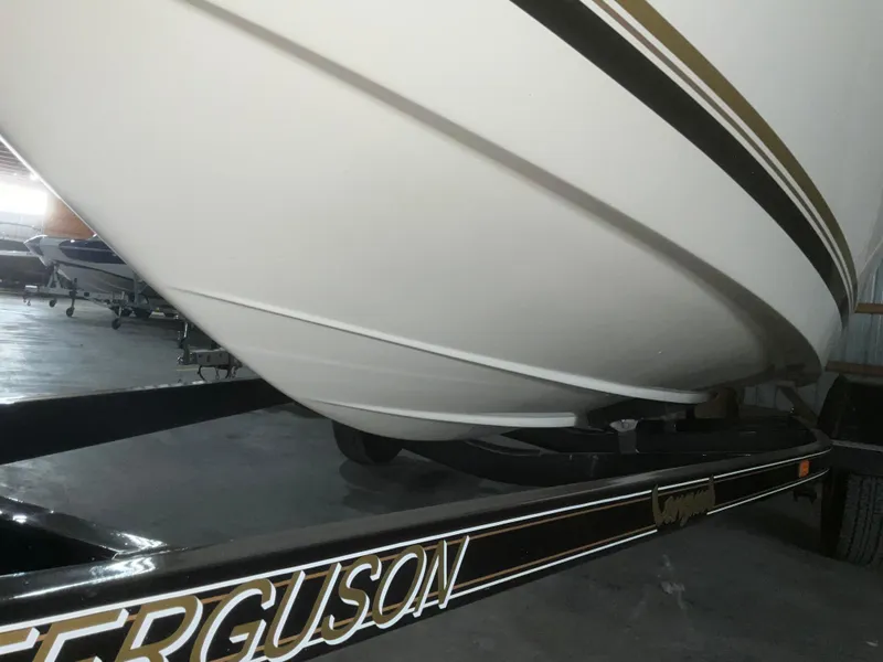 Slide: The Image of 2000 Sea Ray 185 Bow Rider on trailer in storage facility. - 3