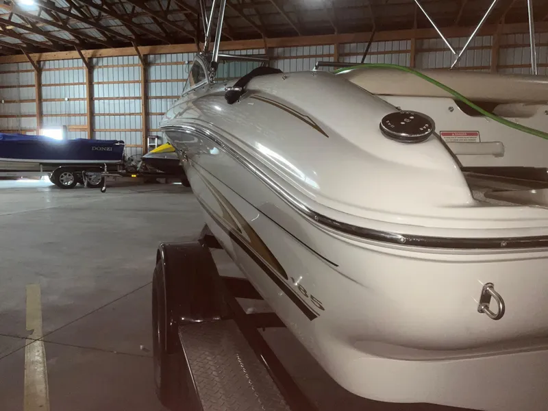 Slide: The Image of 2000 Sea Ray 185 Bow Rider boat in storage facility on trailer. - 5