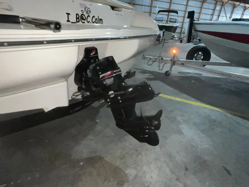 Slide: The Image of 2000 Sea Ray 185 Bow Rider boat with trailer in storage facility. - 7