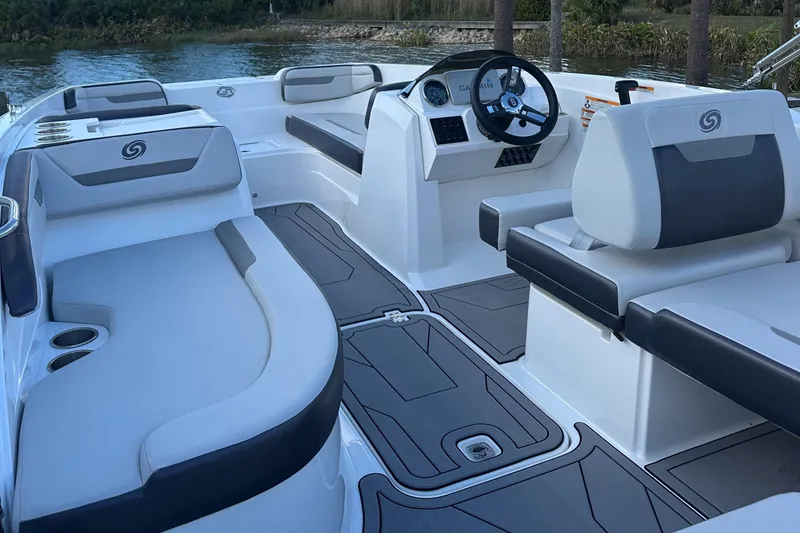 Slide: The Image of 2023 Hurricane SunDeck Sport 205 OB interior with sleek seating and modern dashboard design. - 5