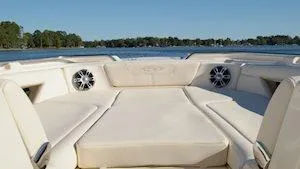 Slide: The Image of 2025 Grady-White Freedom 345 boat interior with spacious seating and scenic water view. - 7