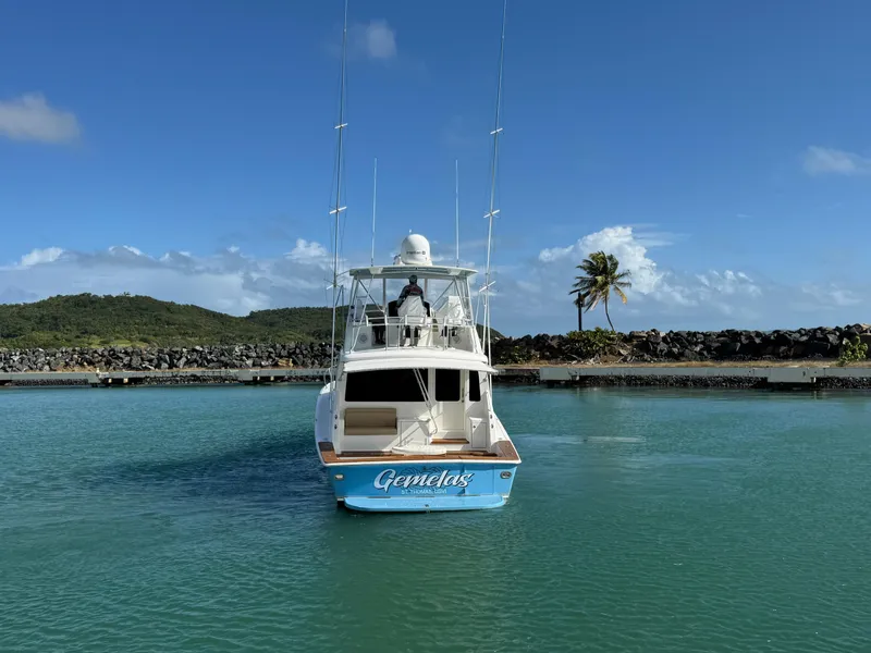 Slide: The Image of 2008 Ocean Yachts 54 Super Sport in serene marina setting, clear skies, and calm waters. - 11