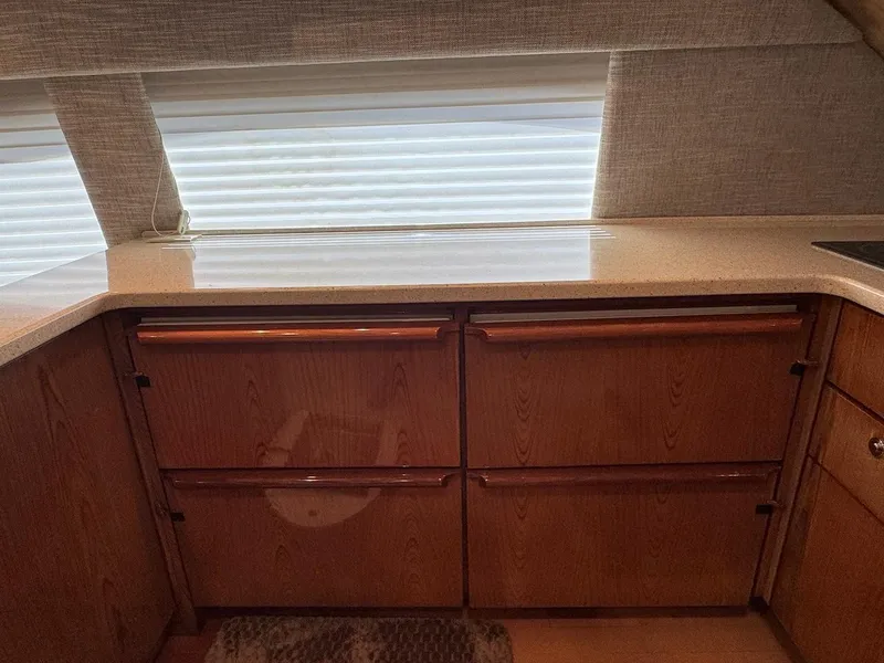 Slide: The Image of Interior of 2008 Ocean Yachts 54 Super Sport with wooden cabinetry and countertop. - 20