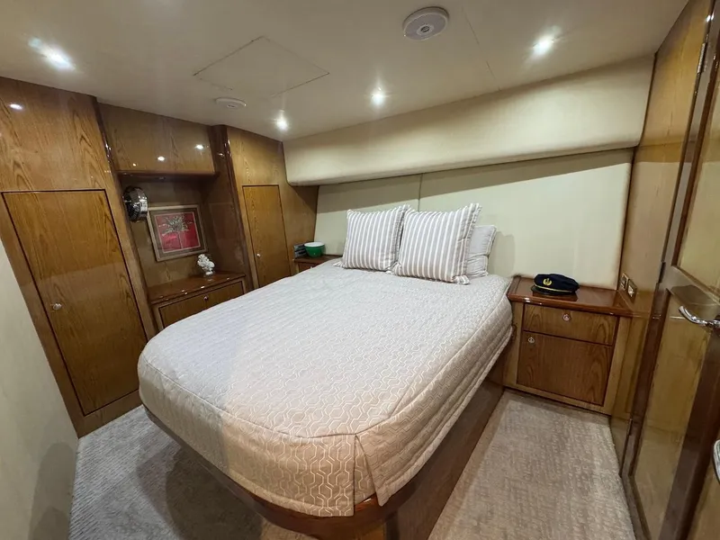 Slide: The Image of Luxurious bedroom in 2008 Ocean Yachts 54 Super Sport with elegant wood finishes. - 23
