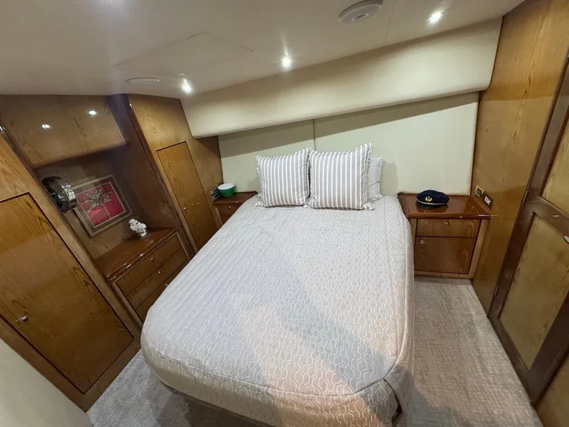 Slide: The Image of Luxurious bedroom interior of 2008 Ocean Yachts 54 Super Sport with elegant wood cabinetry. - 24