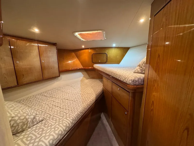 Slide: The Image of Luxurious cabin interior of 2008 Ocean Yachts 54 Super Sport with wooden finish and cozy bedding. - 27