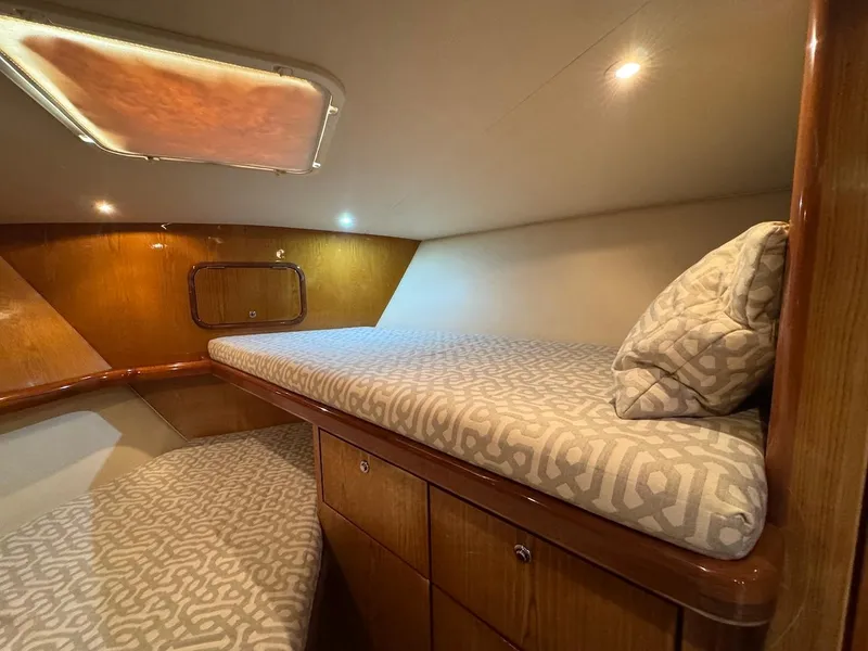 Slide: The Image of Interior cabin of 2008 Ocean Yachts 54 Super Sport with cozy bedding and wood finish. - 28