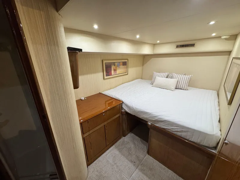 Slide: The Image of Luxurious bedroom in 2008 Ocean Yachts 54 Super Sport with cozy bed and elegant decor. - 31