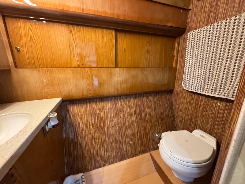 Slide: The Image of Bathroom interior of 2008 Ocean Yachts 54 Super Sport with wood paneling and modern fixtures. - 32