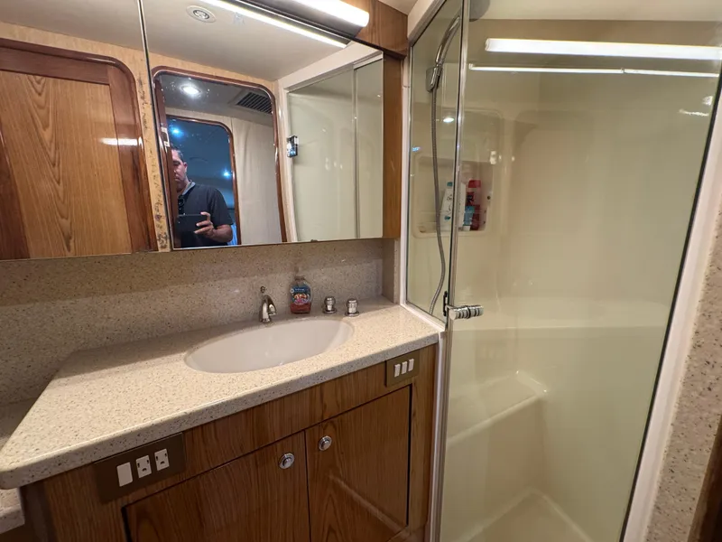 Slide: The Image of Bathroom interior of 2008 Ocean Yachts 54 Super Sport with wooden cabinetry and glass shower. - 37