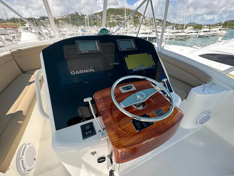 Slide: The Image of Cockpit of 2008 Ocean Yachts 54 Super Sport with Garmin navigation system and wooden steering wheel. - 38