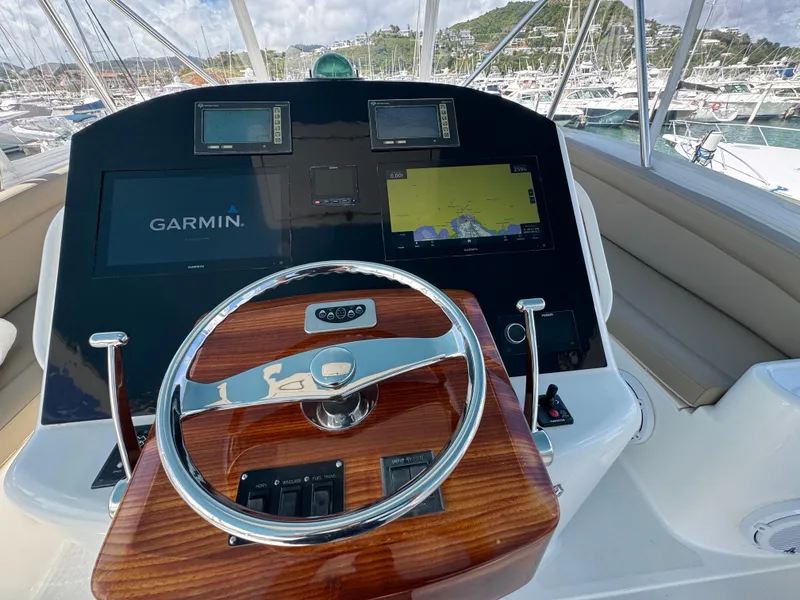 Slide: The Image of 2008 Ocean Yachts 54 Super Sport helm with Garmin navigation system and wooden steering wheel. - 39
