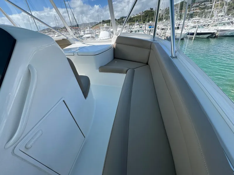 Slide: The Image of 2008 Ocean Yachts 54 Super Sport boat interior with seating, docked in a marina. - 40