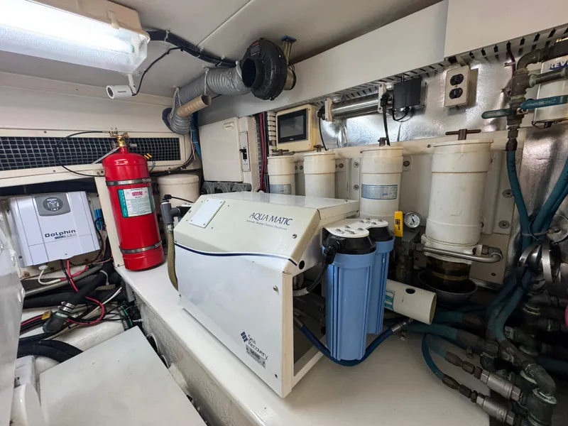 Slide: The Image of Engine room of 2008 Ocean Yachts 54 Super Sport with water filtration system and fire extinguisher. - 44
