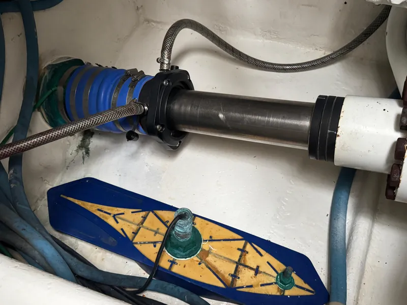 Slide: The Image of Engine room of 2008 Ocean Yachts 54 Super Sport, featuring mechanical components and hoses. - 45