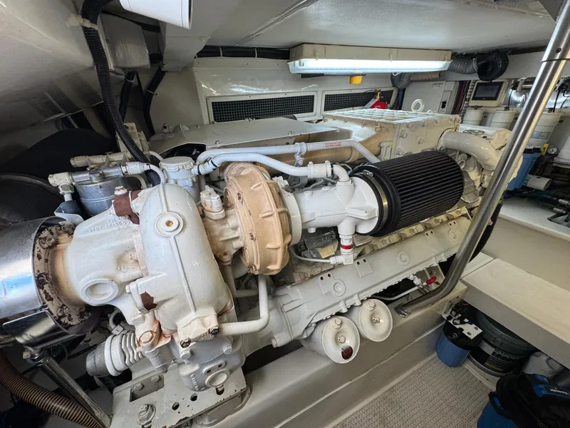 Slide: The Image of Engine room of 2008 Ocean Yachts 54 Super Sport, showcasing detailed machinery and components. - 46