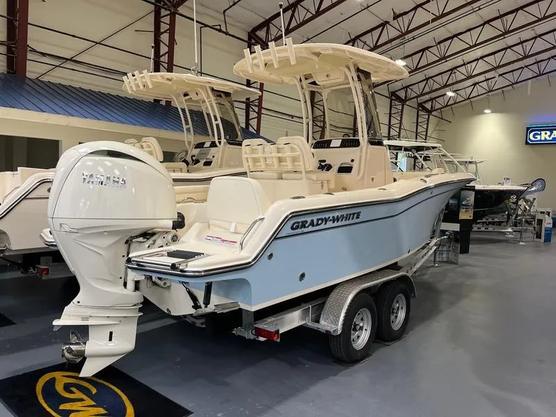 Slide: The Image of 2025 Grady-White Fisherman 216 boat on trailer in showroom. - 12