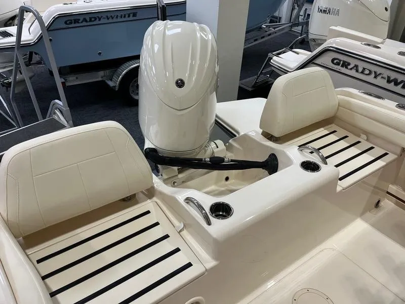 Slide: The Image of 2025 Grady-White Fisherman 216 boat interior with seating and engine view. - 7