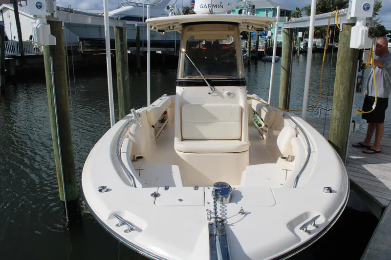 Slide: The Image of 2018 Grady-White Fisherman 257 boat docked in a marina, front view. - 10