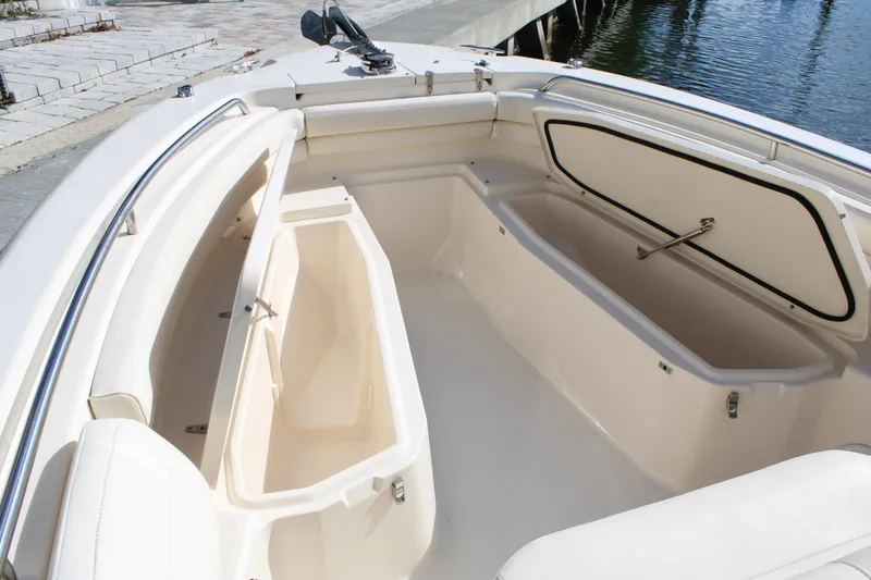 Slide: The Image of 2018 Grady-White Fisherman 257 boat interior with open storage compartments. - 11