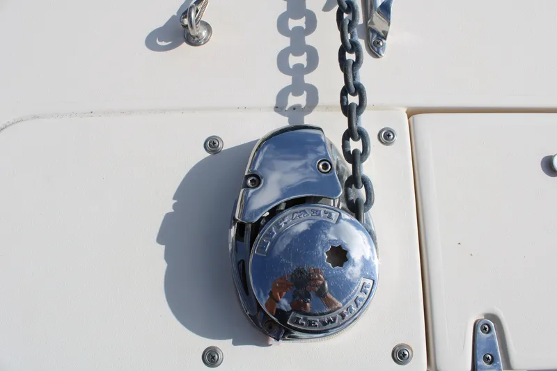 Slide: The Image of Chrome anchor windlass on 2018 Grady-White Fisherman 257 boat deck. - 13