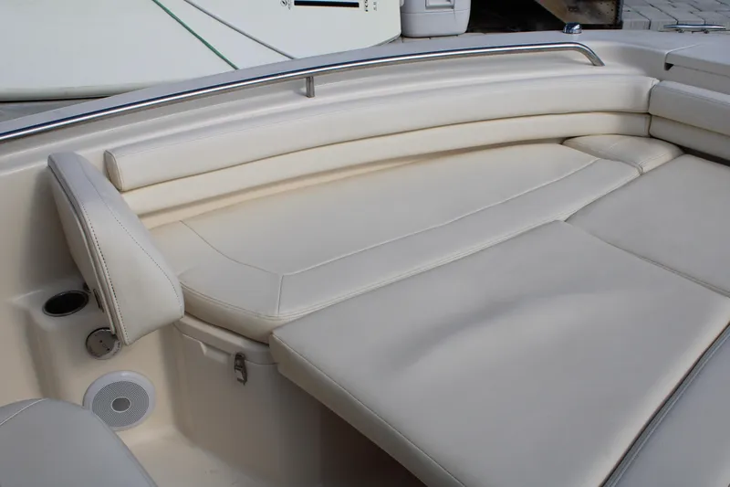 Slide: The Image of 2018 Grady-White Fisherman 257 boat interior with beige cushioned seating. - 19