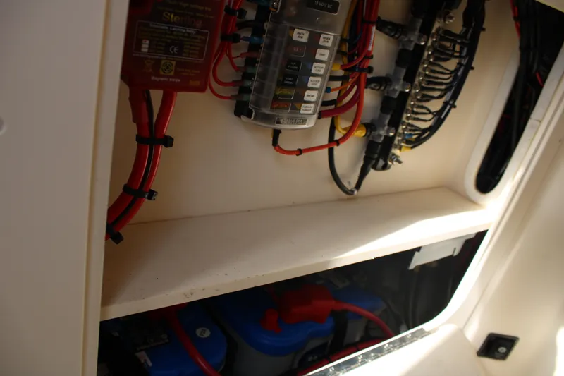 Slide: The Image of Electrical wiring and components inside a 2018 Grady-White Fisherman 257 boat. - 24