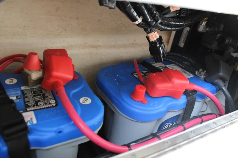 Slide: The Image of Batteries in a 2018 Grady-White Fisherman 257 boat with red and blue connectors. - 25