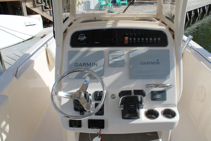 Slide: The Image of 2018 Grady-White Fisherman 257 boat console with Garmin navigation system and steering wheel. - 27