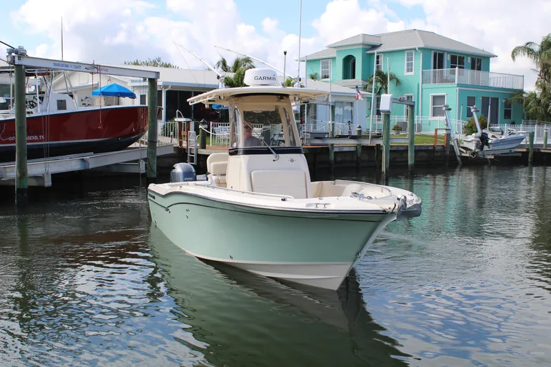 Slide: The Image of 2018 Grady-White Fisherman 257 boat docked near colorful waterfront homes. - 3