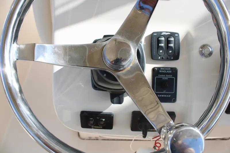 Slide: The Image of Steering wheel and controls of 2018 Grady-White Fisherman 257 boat. - 32