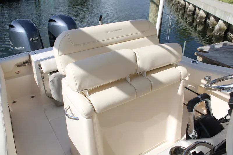 Slide: The Image of 2018 Grady-White Fisherman 257 boat interior with dual engines and cushioned seating. - 37