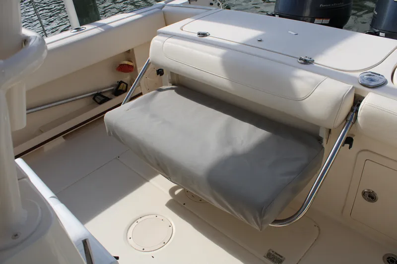 Slide: The Image of 2018 Grady-White Fisherman 257 boat interior with cushioned seating and storage. - 49