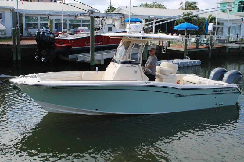 Slide: The Image of 2018 Grady-White Fisherman 257 boat docked in marina, side view. - 5