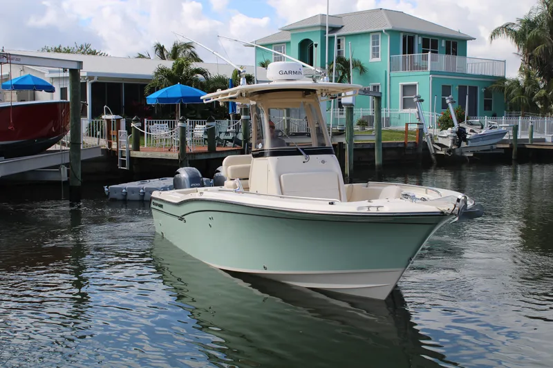 Slide: The Image of 2018 Grady-White Fisherman 257 boat docked near waterfront homes. - 6