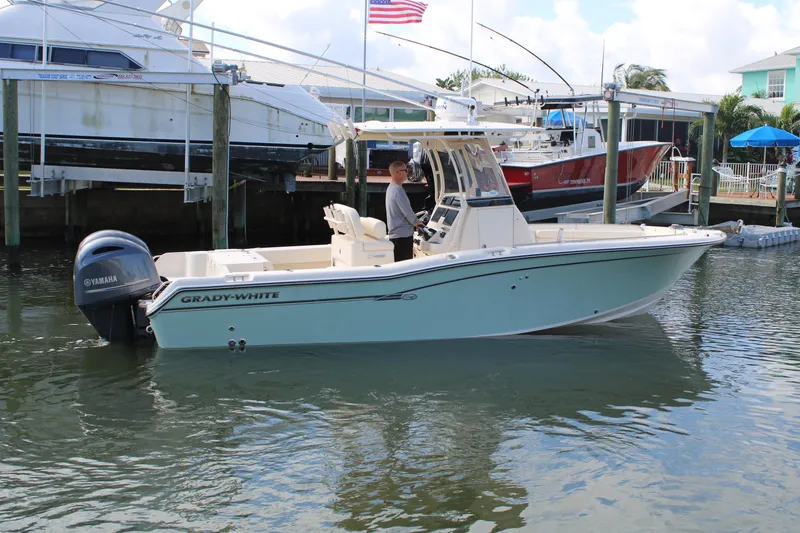 Slide: The Image of 2018 Grady-White Fisherman 257 boat docked, featuring Yamaha engine, in a marina setting. - 8