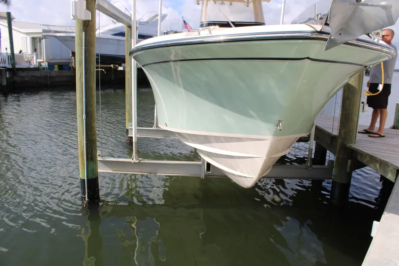 Slide: The Image of 2018 Grady-White Fisherman 257 boat on lift at dockside. - 9