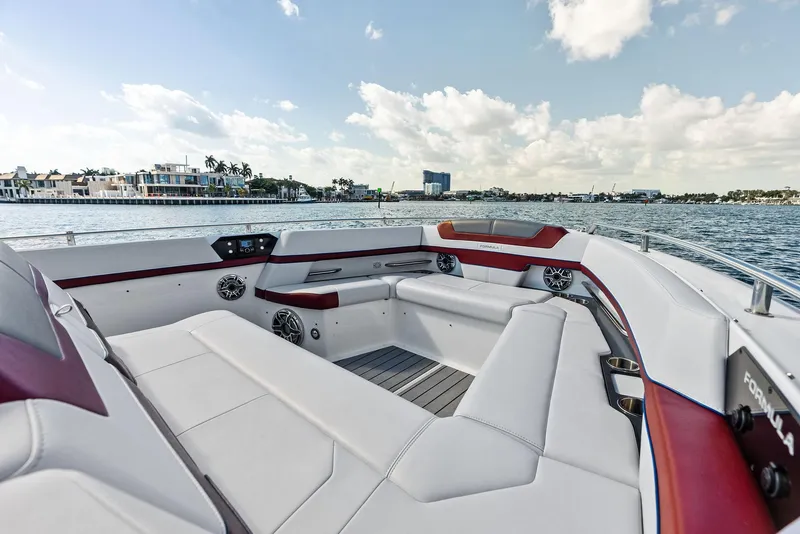 Slide: The Image of 2023 Formula 430 Super Sport Crossover boat interior with luxurious seating on a sunny day. - 17