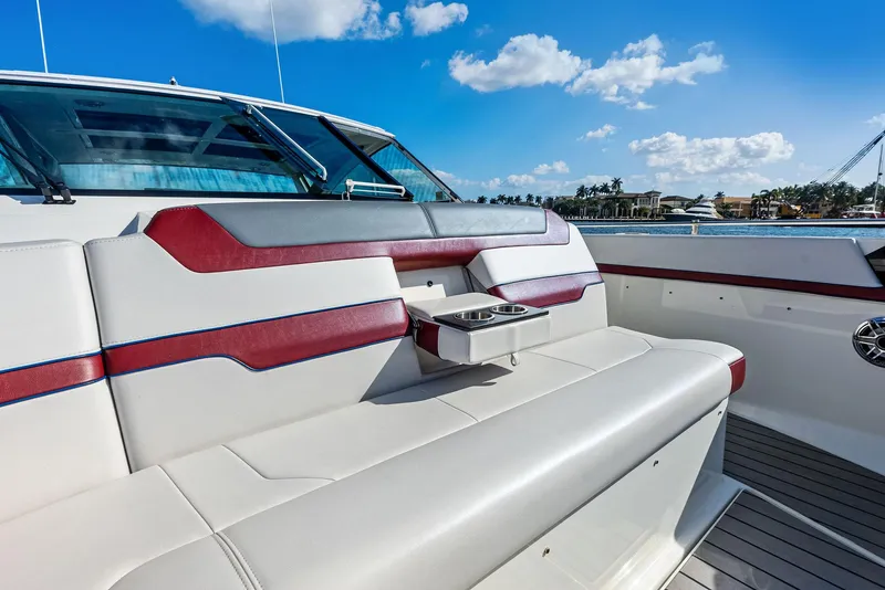 Slide: The Image of 2023 Formula 430 Super Sport Crossover boat interior with luxurious seating and cup holders. - 18