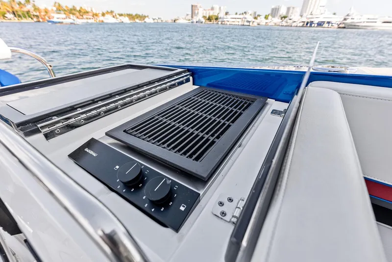 Slide: The Image of Outdoor grill on 2023 Formula 430 Super Sport Crossover boat, with scenic waterfront view. - 24