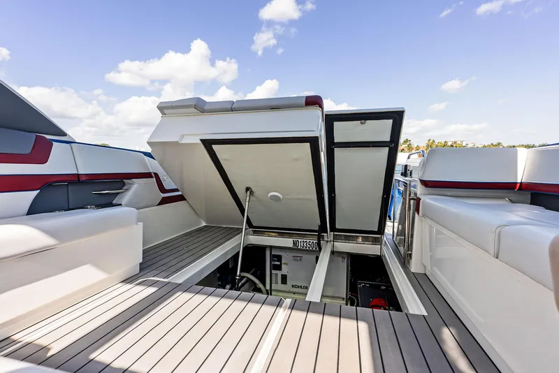 Slide: The Image of 2023 Formula 430 Super Sport Crossover yacht with open engine compartment, showcasing luxury design. - 27