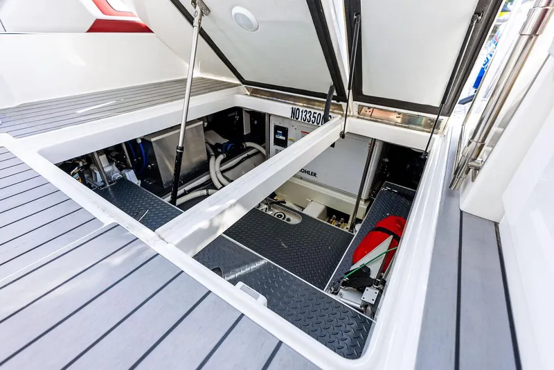 Slide: The Image of Engine compartment of 2023 Formula 430 Super Sport Crossover boat, showcasing interior components. - 29