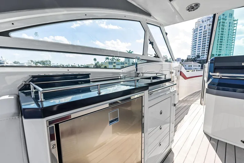 Slide: The Image of 2023 Formula 430 Super Sport Crossover yacht interior with sleek kitchen and modern design. - 38