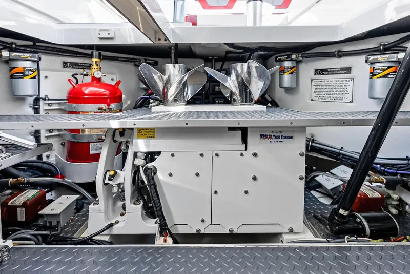 Slide: The Image of Engine room of 2023 Formula 430 Super Sport Crossover with fire extinguisher and mechanical components. - 49